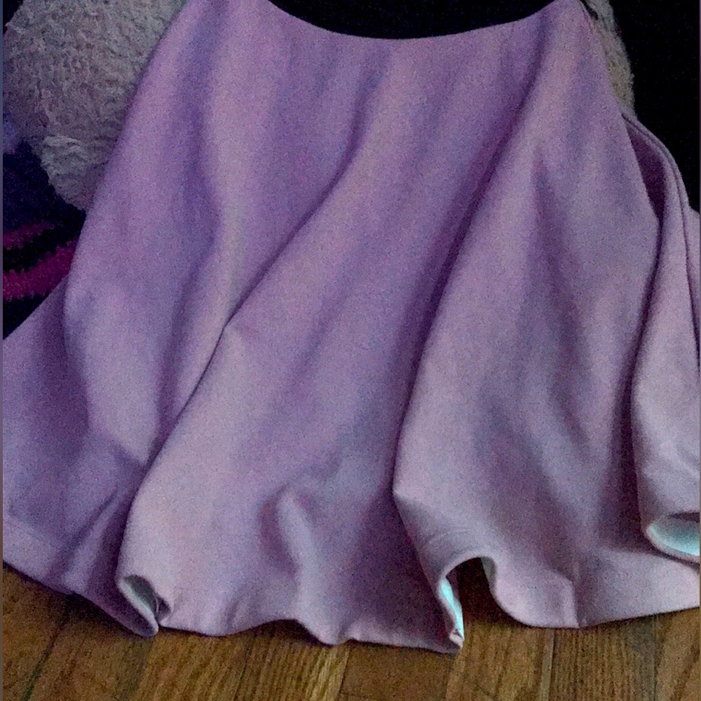 a pink pleated and black lace dress